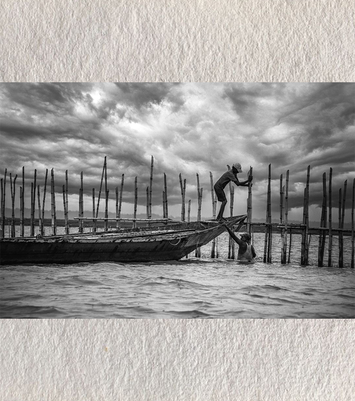 Premium Black & White Photographic Art – "Saving the Boat" at Chilika Lake, Odisha by Sayantan Sengupta (8"x12") | Indi Temptation