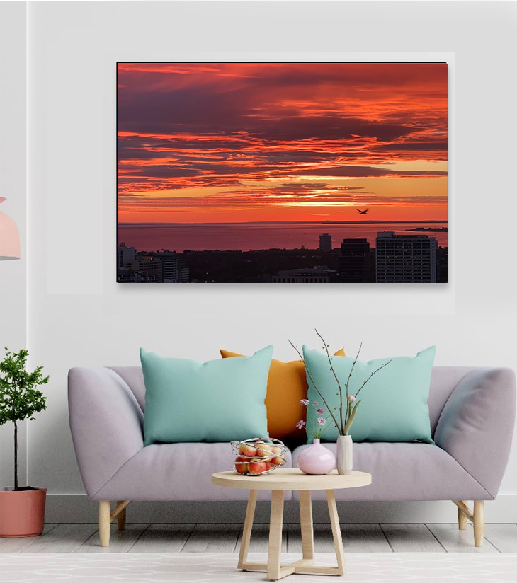 Photographer: Ankita Sengupta Short Description: A lone bird glides across a canvas of molten gold and ember skies in this serene sunset over Melbourne Bay. Captured by Ankita Sengupta, this frame freezes the harmony between urban life and nature’s quiet poetry. Highlights: • Striking silhouette of a bird in mid-flight • Deep orange and vermillion sky over tranquil waters • Ideal for living rooms or workspaces needing warmth and calm • Premium archival print on textured art paper • Size: Various| Custom frame available ________________________________________ Theme: Solitude and Freedom in the Urban Sky This frame celebrates stillness in motion—freedom captured in flight, the horizon cradled in fire, and peace found in the quiet breath between day and night.